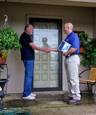 Company worker shaking hands with the customer